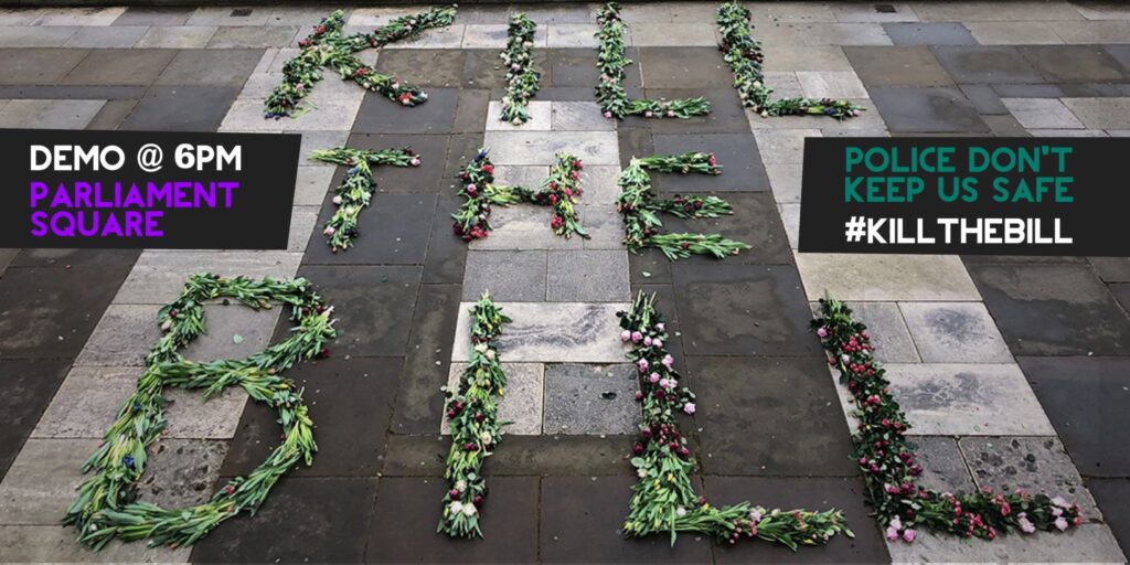 Flowers arranged on a concrete floor to spell the words: "Kill The Bill" on the left hand side there is a black box superimposed which contains the following text: "Demo @ 6pm Parliament Square" and another on the right hand side saying: "Police don't keep us safe #KillTheBill"